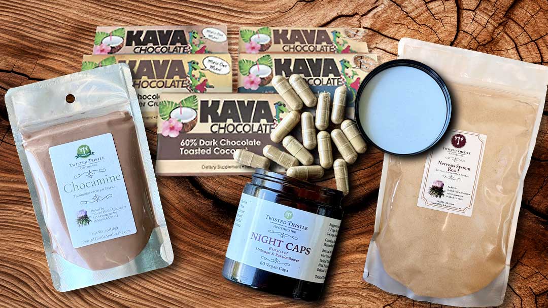 Chocamine, Kava Chocolate Bars, NightCaps, Nervous System Reset laid out ready for a festival
